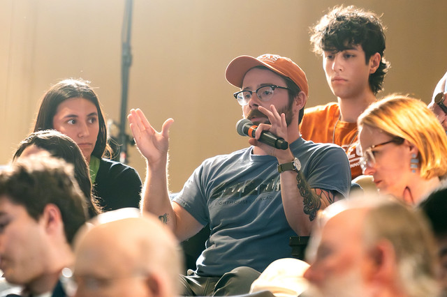 An audience member asking a question at a Forum session