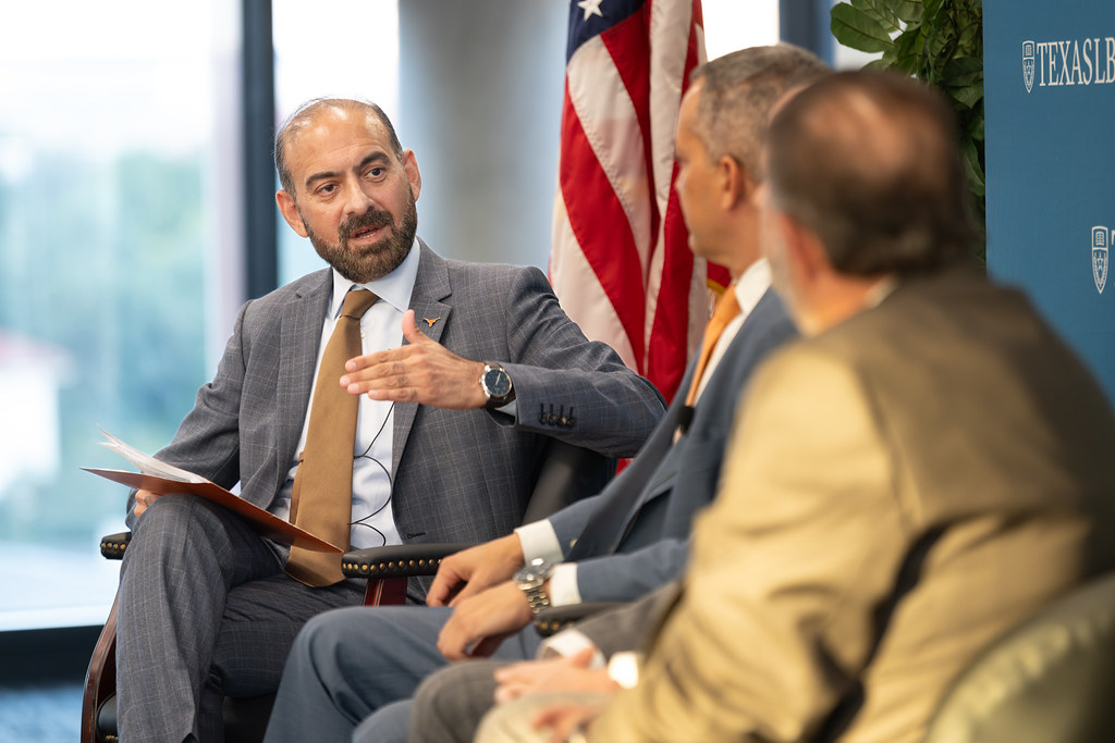 Dilawar Syed on a panel with an American flag